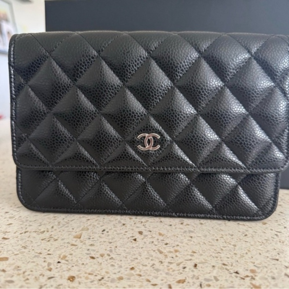 CHANEL Petite Maroquinerie black quilted wallet on a chain